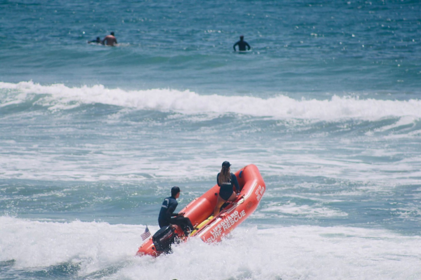 Isabella on a City of Del Mar lifeguard rescue boat heading into the surf