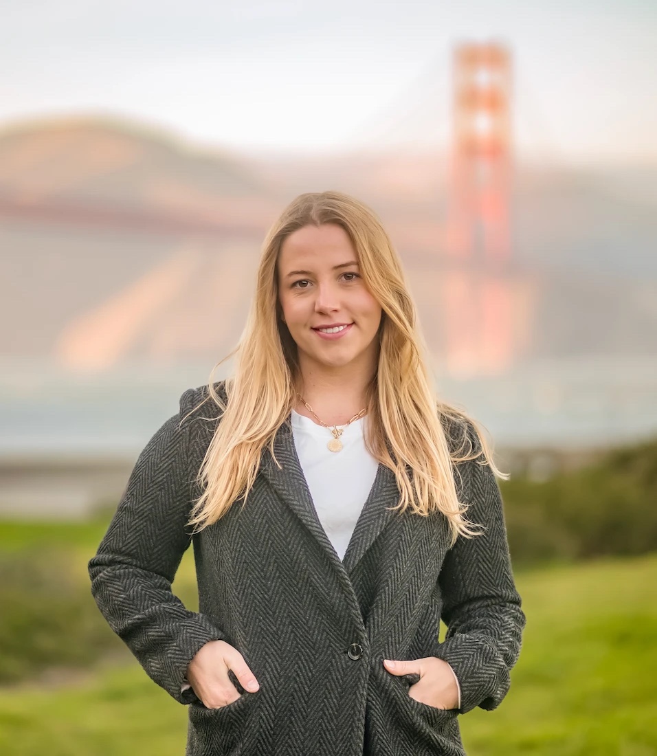 Isabella Otterson in San Francisco, with the Golden Gate Bridge behind her